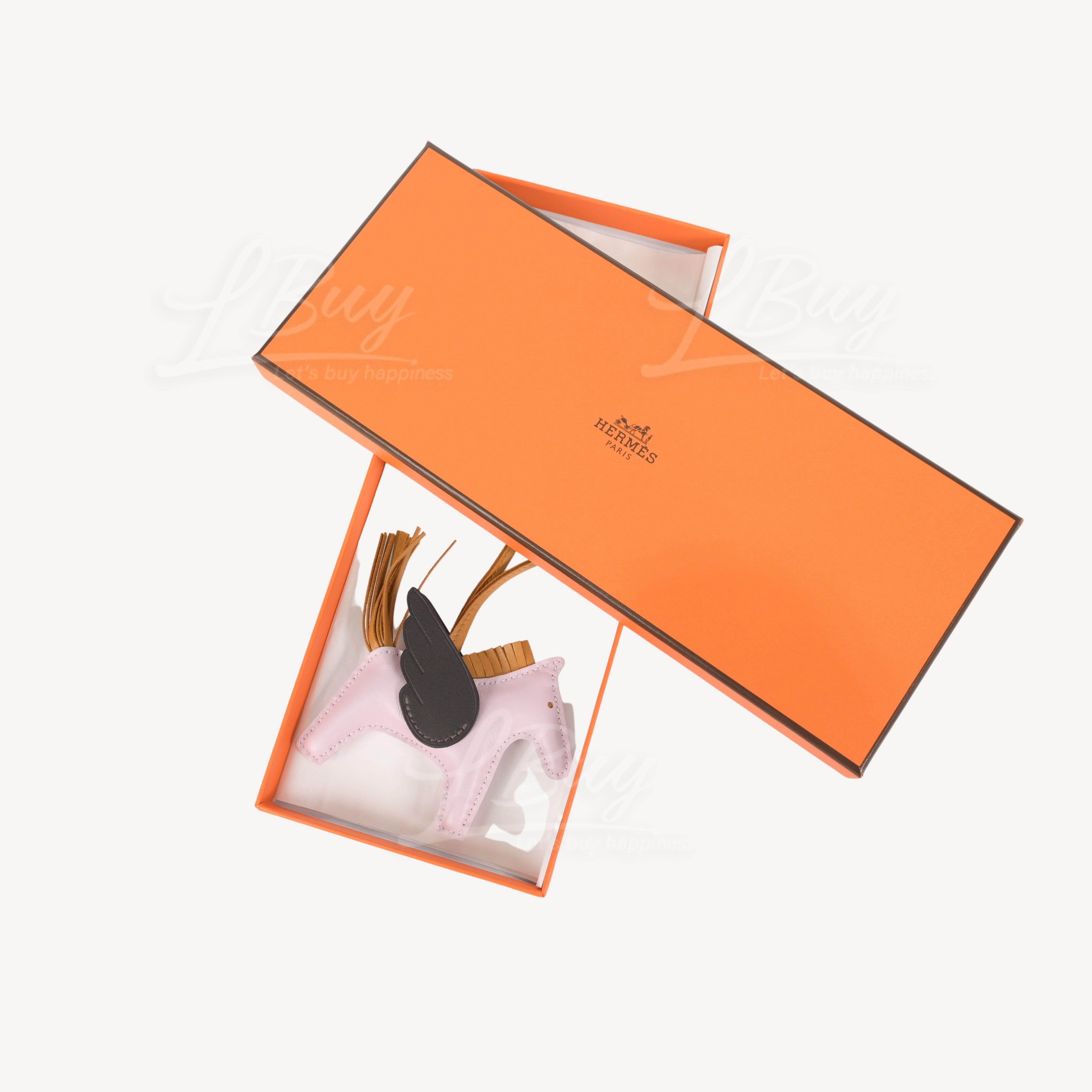 Sold at Auction: Hermès: a Mauve Pale, Sesame and Ebene Rodeo Pegase PM  Charm 2022 (includes box)