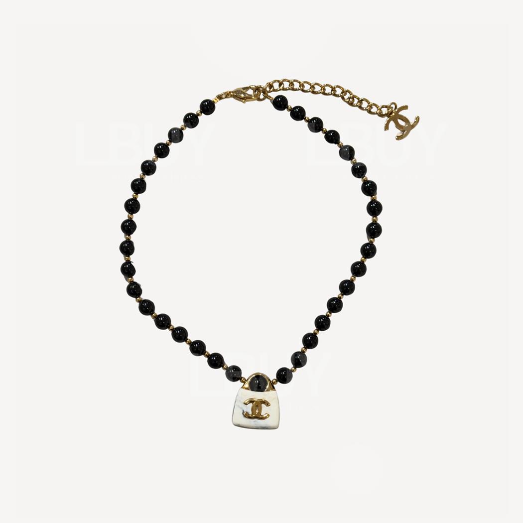 Chanel black pearl white handbag pendant necklace
